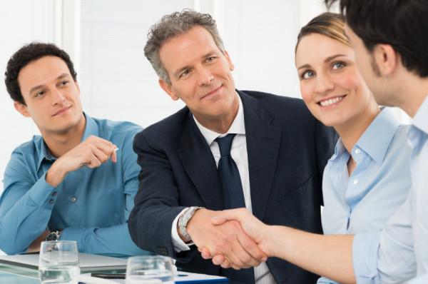 people engaging in a business deal