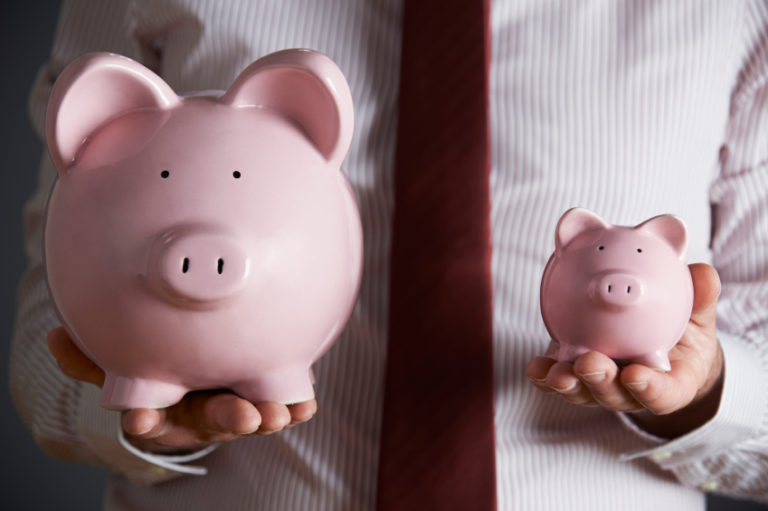 two piggy banks of different sizes