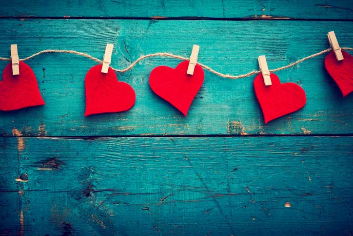 cutout hearts clipped on a clothesline