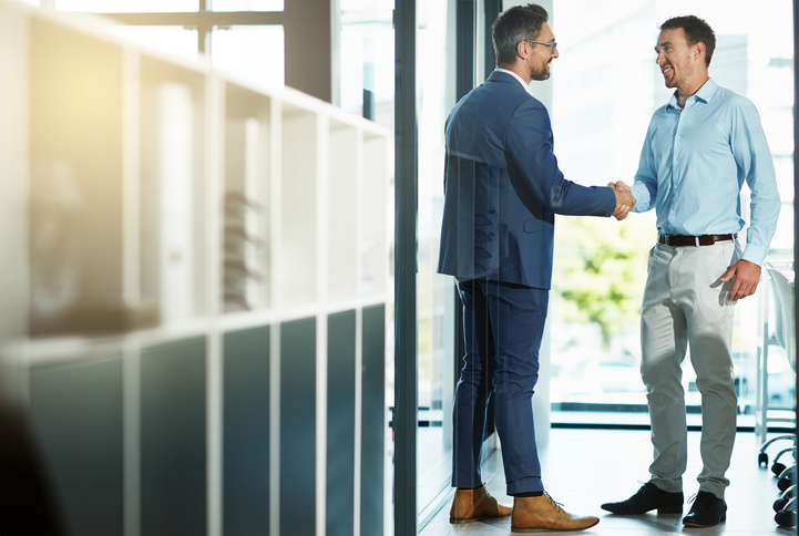 two businessmen agreeing to a business deal